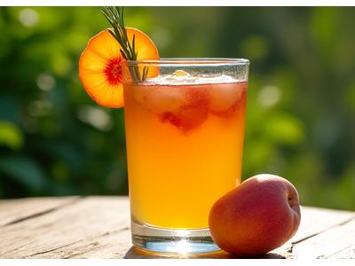 A glass of homemade kombucha with fresh fruit and herbs, with a backdrop of a Texas hill country landscape.