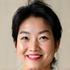 Portrait of Sarah Chen, a radiant woman in her late 40s