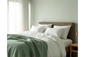 A serene bedroom with soft, inviting lighting, symbolizing restful sleep.